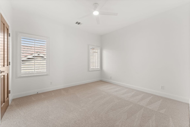 15 Borello Dr, Austin, TX 78738 - spare room with a ceiling fan, healthy amount of natural light, and light carpet