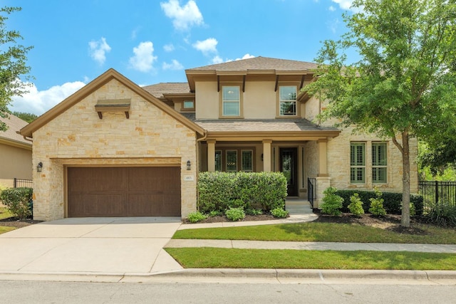 4101 Front Range Ln, Austin, TX 78732 - view of front facade with a garage, fence, stone siding, stucco siding, and concrete driveway