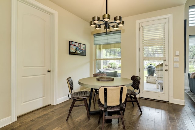 4101 Front Range Ln, Austin, TX 78732 - dining space featuring a chandelier and dark wood-style floors