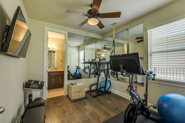 4101 Front Range Ln, Austin, TX 78732 - exercise area with baseboards, a ceiling fan, and dark wood-style flooring