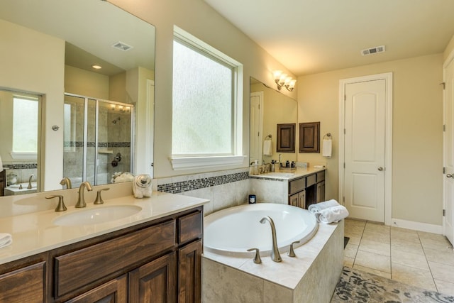 4101 Front Range Ln, Austin, TX 78732 - full bathroom featuring visible vents, a sink, a bath, and a shower stall