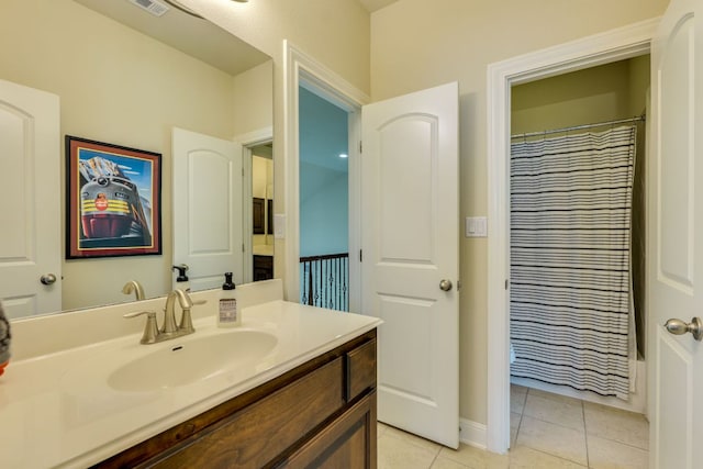 4101 Front Range Ln, Austin, TX 78732 - full bath with vanity, tile patterned flooring, baseboards, and a shower with curtain