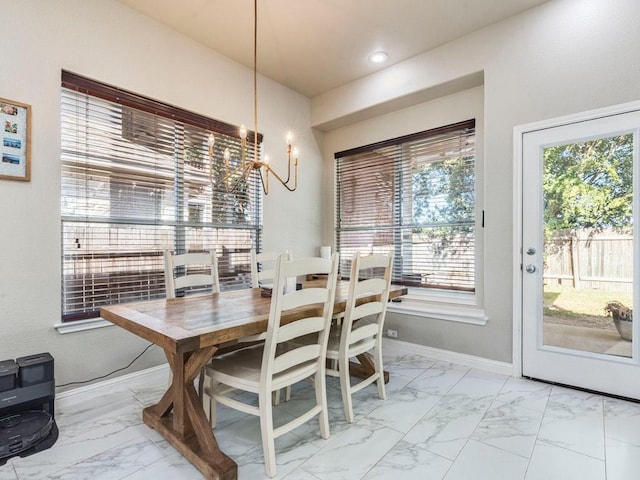 dining room with recessed lighting, baseboards, a chandelier, and marble finish floor