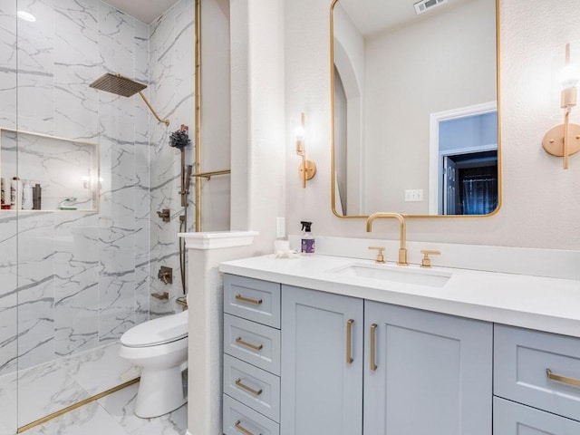 full bathroom featuring vanity, toilet, a marble finish shower, marble finish floor, and visible vents