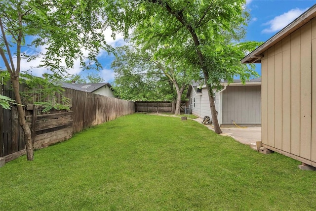 view of yard with a fenced backyard
