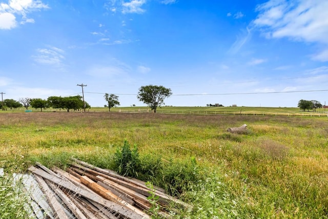 view of yard with a rural view