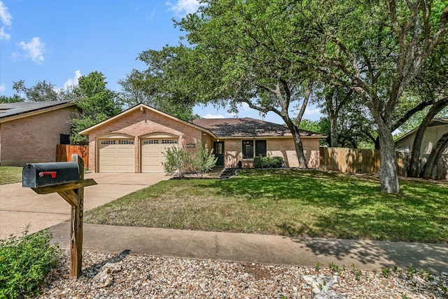 single story home with concrete driveway, brick siding, an attached garage, and fence