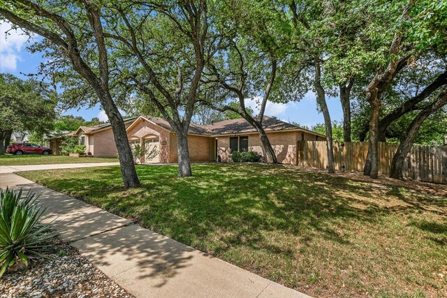 2604 Fentonridge Dr, Austin, TX 78745 - view of front of property featuring brick siding and an attached garage
