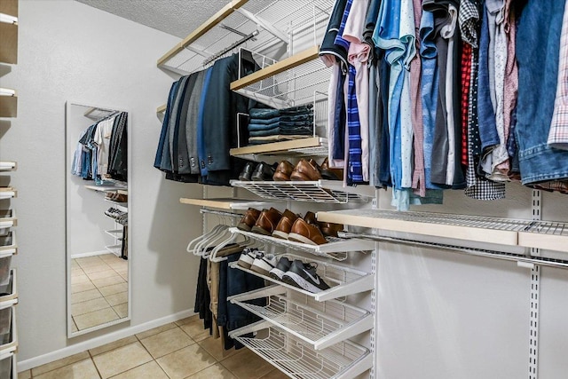 spacious closet featuring tile patterned floors
