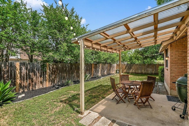 view of patio featuring a pergola, outdoor dining area, and a fenced backyard