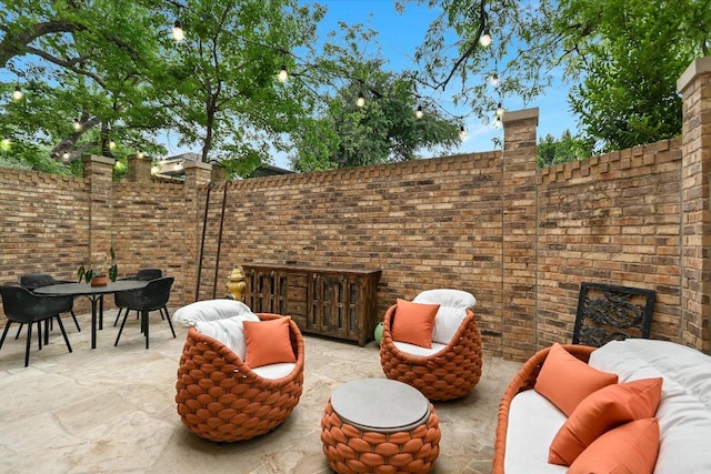 view of patio / terrace with outdoor dining area and an outdoor hangout area