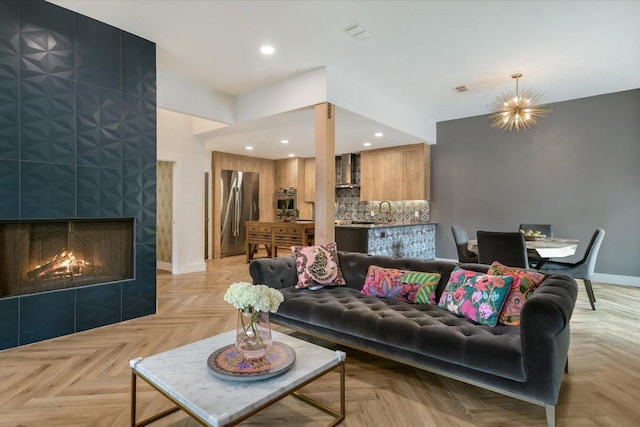 living room with recessed lighting, baseboards, visible vents, and a fireplace