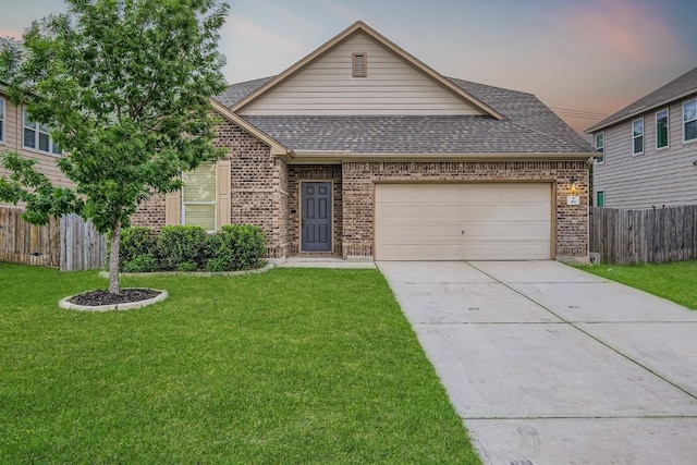 view of front of property with fence, an attached garage, a shingled roof, brick siding, and concrete driveway