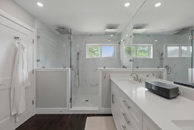 7421 Ponoma Trl, Austin, TX 78749 - full bathroom with a sink, a marble finish shower, double vanity, and wood finished floors