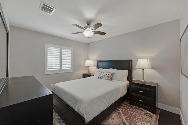 7421 Ponoma Trl, Austin, TX 78749 - bedroom with a ceiling fan, baseboards, visible vents, and dark wood-style floors