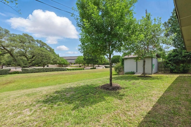7421 Ponoma Trl, Austin, TX 78749 - view of yard featuring an outdoor structure, a shed, and fence