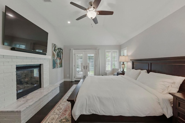 7421 Ponoma Trl, Austin, TX 78749 - bedroom featuring a fireplace, access to exterior, dark wood-type flooring, french doors, and vaulted ceiling
