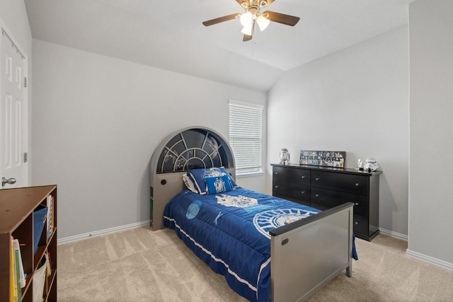 bedroom with baseboards, light colored carpet, ceiling fan, and vaulted ceiling