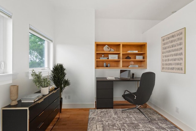 3800 Laurel Ledge Ln, Austin, TX 78731 - office area featuring wood finished floors, built in study area, and baseboards