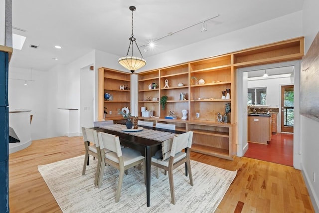 3800 Laurel Ledge Ln, Austin, TX 78731 - dining space featuring light wood-style flooring, recessed lighting, and track lighting
