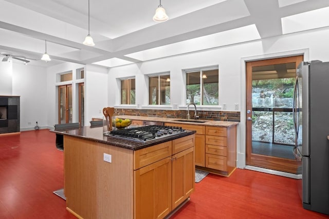 3800 Laurel Ledge Ln, Austin, TX 78731 - kitchen with stainless steel appliances, decorative backsplash, dark wood finished floors, dark stone countertops, and open floor plan