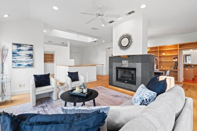 3800 Laurel Ledge Ln, Austin, TX 78731 - living area featuring rail lighting, wood finished floors, ceiling fan, and recessed lighting