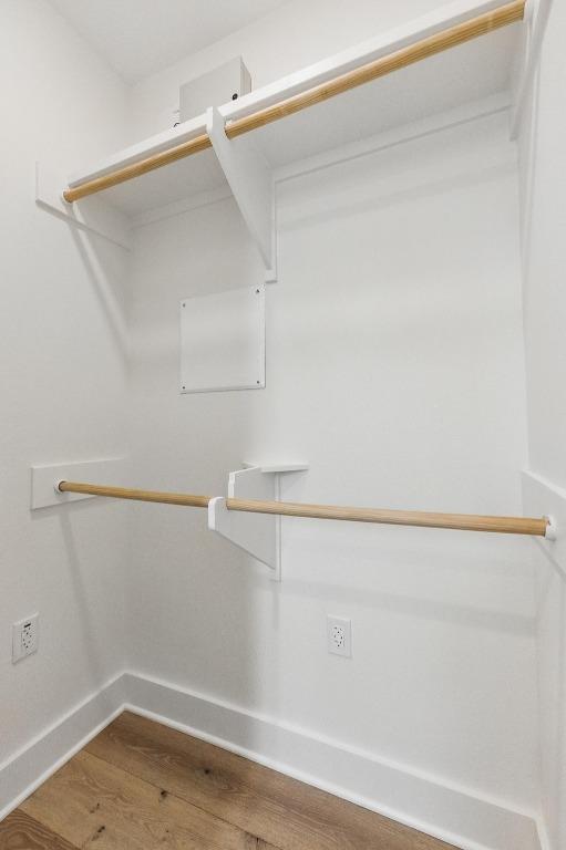 spacious closet featuring wood finished floors