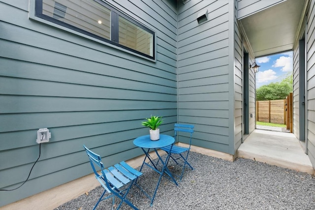 view of patio featuring fence