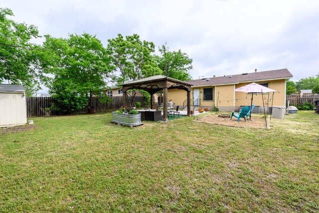 7103 Howerington Cir, Austin, TX 78724 - rear view of house featuring a gazebo, stucco siding, and a patio area