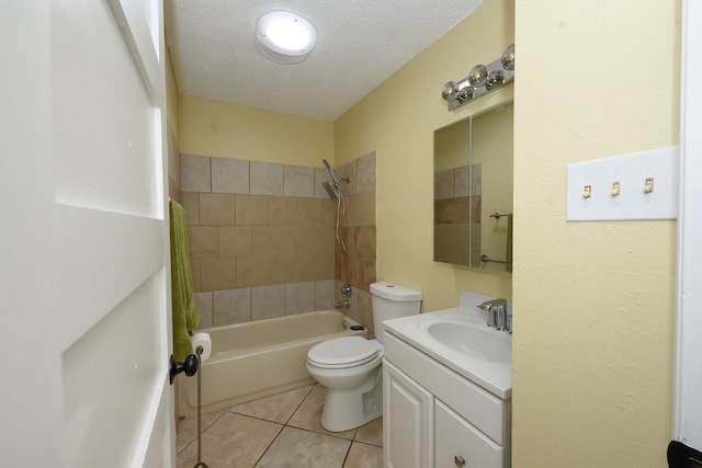 7103 Howerington Cir, Austin, TX 78724 - bathroom with bathtub / shower combination, vanity, tile patterned floors, toilet, and a textured ceiling