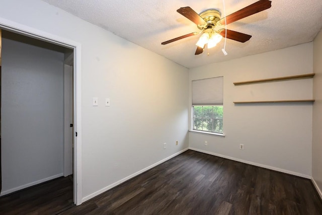 7103 Howerington Cir, Austin, TX 78724 - unfurnished room with dark wood-style flooring, baseboards, a ceiling fan, and a textured ceiling