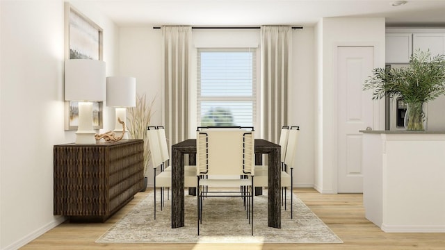 sitting room featuring baseboards and light wood-style flooring