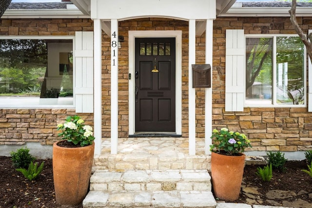 entrance to property with stone siding