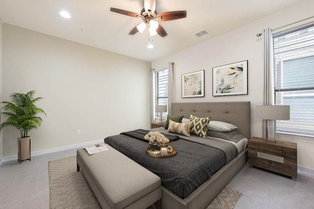 bedroom featuring recessed lighting, baseboards, visible vents, and light carpet