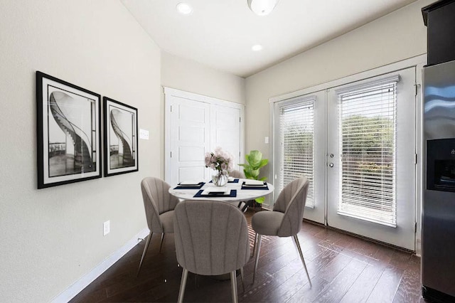 dining area with recessed lighting, baseboards, and dark wood-type flooring