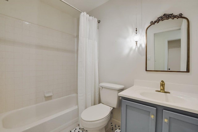 bathroom featuring vanity, shower / bath combo with shower curtain, and toilet
