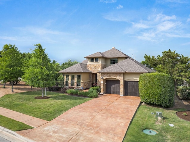 103 Maddy Way, Austin, TX 78738 - view of front of home featuring stone siding, stucco siding, driveway, a front yard, and a garage