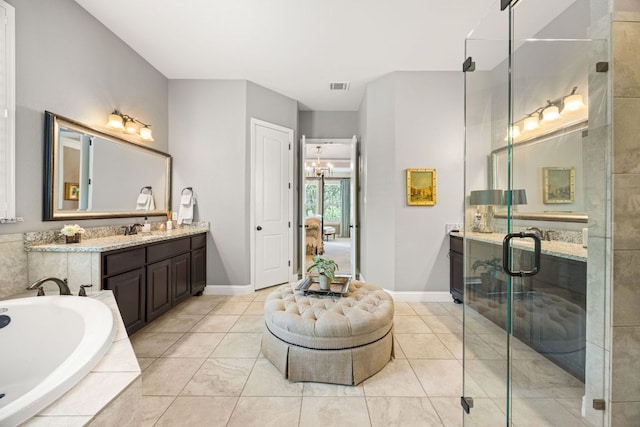 103 Maddy Way, Austin, TX 78738 - full bathroom featuring vanity, a bath, a shower stall, and tile patterned floors