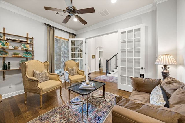 103 Maddy Way, Austin, TX 78738 - living area featuring arched walkways, ceiling fan, ornamental molding, stairs, and wood finished floors