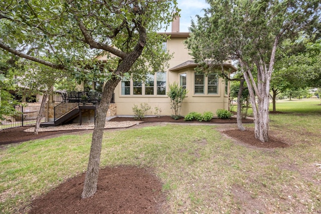 103 Maddy Way, Austin, TX 78738 - view of front of house with stucco siding, stairway, and a chimney