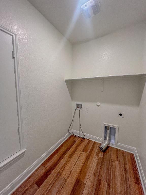 washroom with laundry area, wood finished floors, hookup for a washing machine, gas dryer hookup, and electric dryer hookup