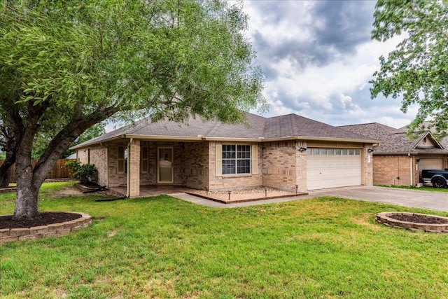 118 San Gabriel Dr, Kyle, TX 78640 - single story home featuring fence, brick siding, driveway, a garage, and a front yard