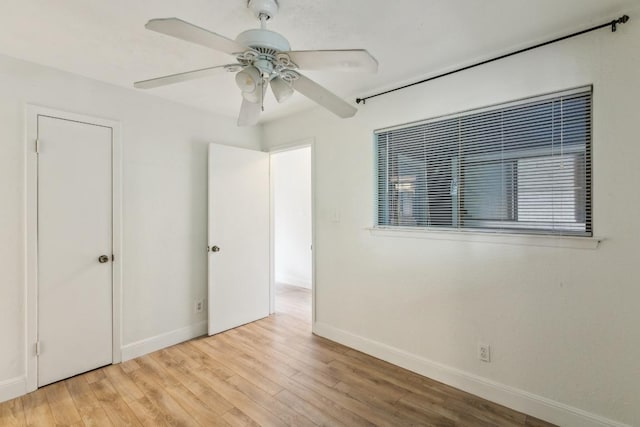 2500 Burleson Rd Unit 321, Austin, TX 78741 - unfurnished bedroom with baseboards, ceiling fan, and wood finished floors