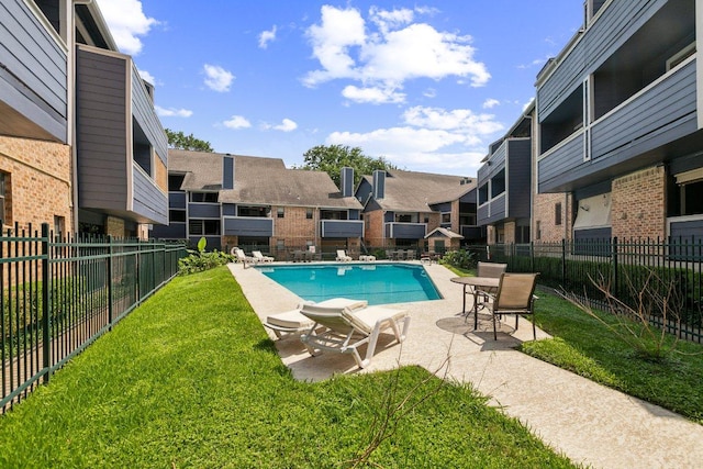 2500 Burleson Rd Unit 321, Austin, TX 78741 - pool with a yard, a patio, fence, and a residential view