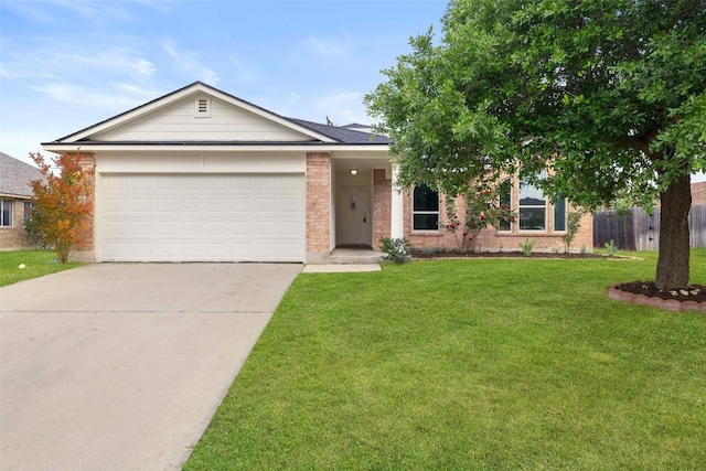 single story home with brick siding, an attached garage, driveway, and a front lawn
