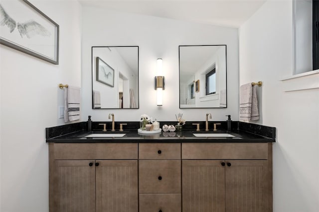 bathroom with a sink and double vanity
