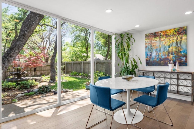 sunroom / solarium with outdoor dining space