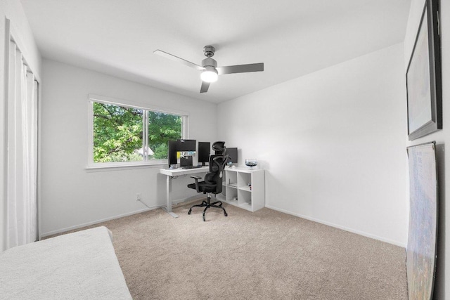 office area with baseboards, carpet, and a ceiling fan