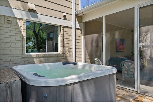 view of patio / terrace featuring a hot tub