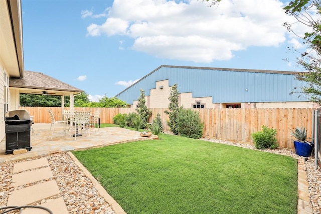 view of yard featuring a fenced backyard and a patio